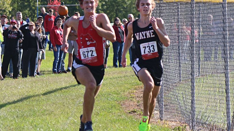 Wayne’s Lucas Houk (right) and Milton-Union’s Shannon Milnickel race to the finish in Saturday’s Brookville Invitational. Greg Billing/Contributed photo