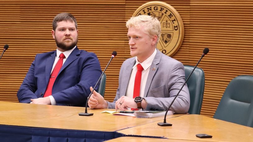 Ohio State Representative 71st District candidate Joshua Day speaks with voters as candidate Tyler Scott looks on at a debate for the March primary election at Springfield City Hall Forum Monday, Feb. 12, 2024. JESSICA OROZCO/STAFF