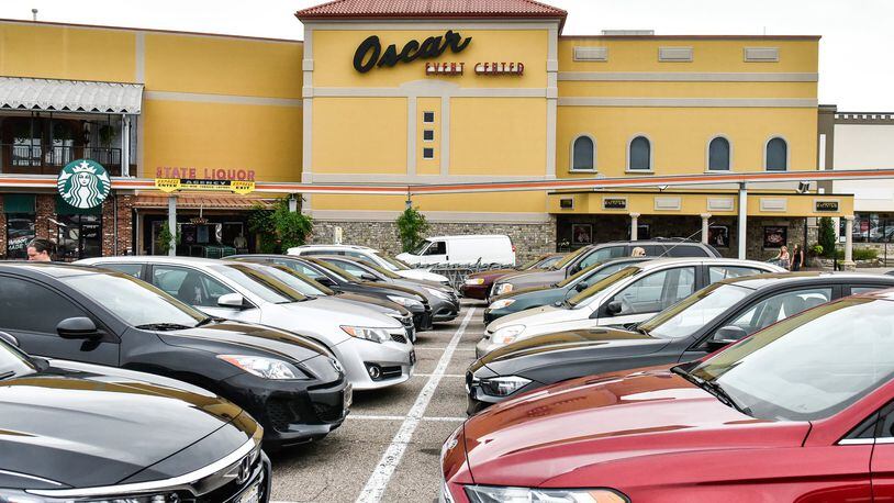 Vehicles are parked outside of the Oscar Event Center at Jungle Jim’s International Market Friday, July 6 in Fairfield. NICK GRAHAM/STAFF