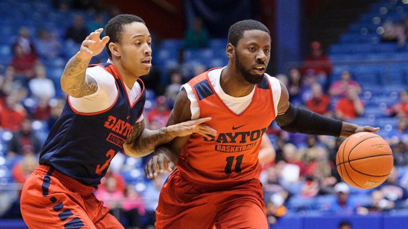 Soochie Smith, right, dribbles by Kyle Davis during Dayton’s Red and Blue Game on Saturday, Oct. 22 at U.D. Arena. Contributed Photo by Bryant Billing