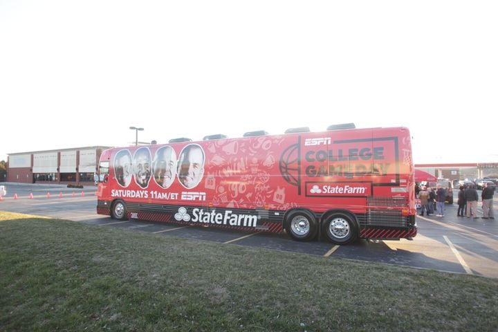 College basketball fans get an early view  of the ESPN College GameDay bus in Huber Heights at the Krogers on Old Troy Pike Thursday.