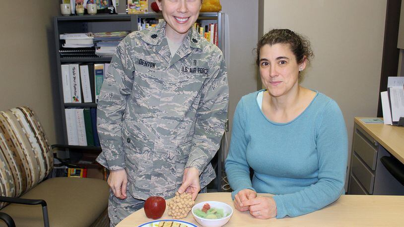 Lt. Col. Amanda Denton, Nutritional Medicine Flight commander and AFMC nutrition consultant, and Kendra Schmuck, Nutrition Clinic manager, can help patients achieve their personal nutrition goals for a healthier lifestyle. The 88th Medical Group Nutrition Clinic provides medical nutritional therapy for active duty members, retirees and their dependents offering classes and individual appointments to provide nutritional guidance. (U.S. Air Force photo/Stacey Geiger)