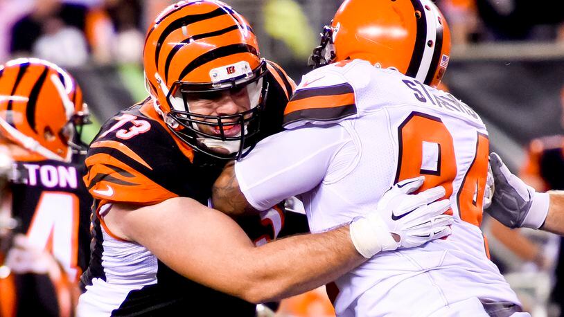 Cincinnati Bengals offensive tackle Eric Winston (73) stands up Cleveland Browns defensive end Randy Starks (94) during the Bengals’ 31-10 win Thursday, Nov. 5 at Paul Brown Stadium in Cincinnati. The Bengals are now 8-0 on the season. NICK GRAHAM/STAFF