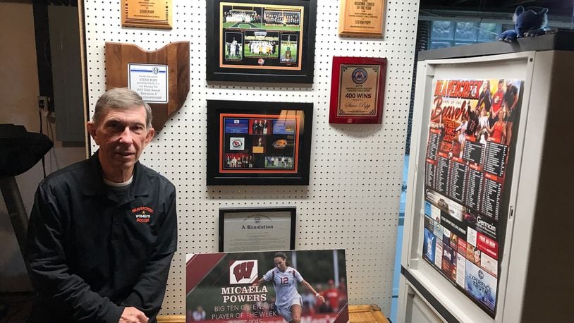 Steve Popp  with some of the memorabilia from his storied career coaching girls soccer. His biggest accomplishment though is coming back from a heart transplant on Jan. 4 and coaching his team to a 17-4 record and the regional semifinals. He was named the GWOC Coach of the Year. Tom Archdeacon/STAFF