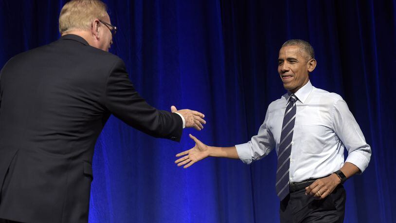 President Barack Obama, right, shakes hands with former Ohio Gov. Ted Strickland, left, as he arrives to speak at a campaign event for the Ohio Democratic Party and Strickland’s Senate bid at the Greater Columbus Convention Center in Columbus, Ohio, Thursday, Oct. 13, 2016. (AP Photo/Susan Walsh)
