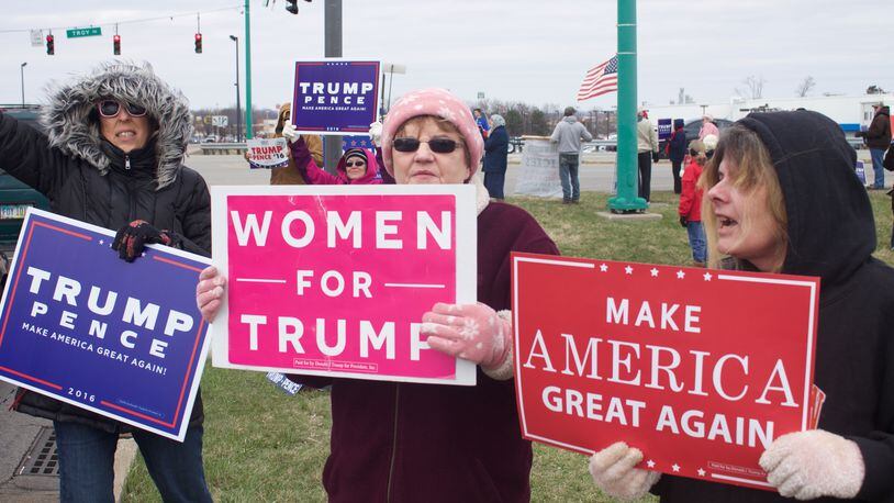 More than a dozen people showed up at the corner of State Route 41 and North Bechtle Avenue in Springfield on Saturday to show support for President Donald Trump and his policies. HASAN KARIM/STAFF