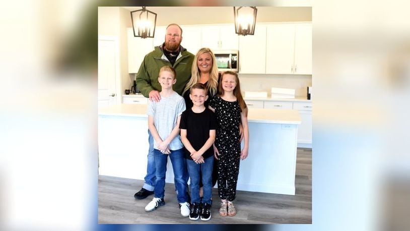 The Zurn family in the kitchen of their new home.