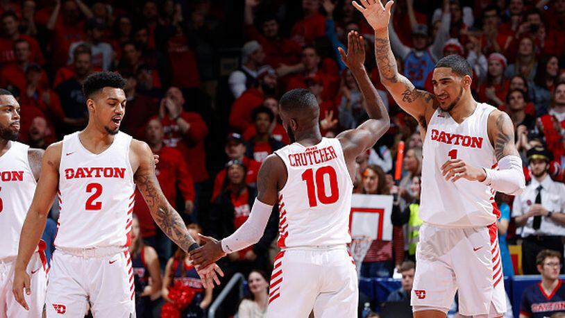 DAYTON, OH - MARCH 07: Obi Toppin #1, Jalen Crutcher #10 and Ibi Watson #2 of the Dayton Flyers celebrate against the George Washington Colonials in the second half of a game at UD Arena on March 7, 2020 in Dayton, Ohio. Dayton defeated George Washington 76-51. (Photo by Joe Robbins/Getty Images)