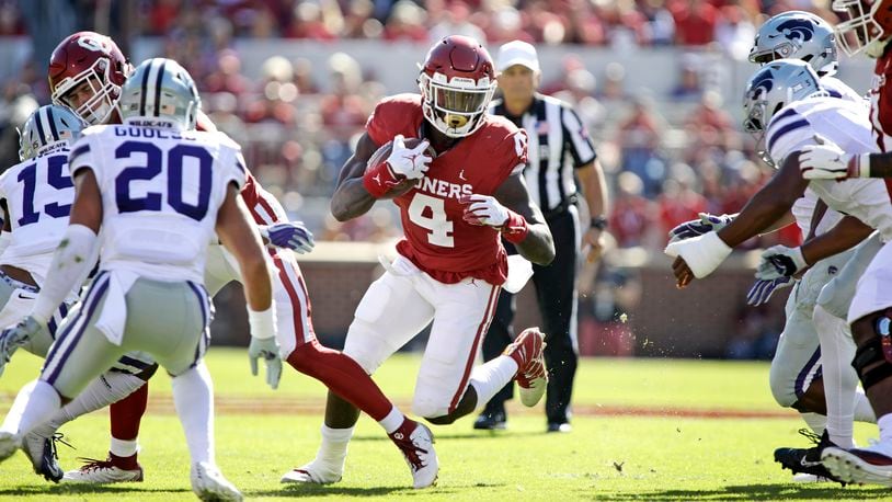 Oklahoma running back Trey Sermon looks for a hole against the Kansas State Wildcats at Gaylord Family Oklahoma Memorial Stadium on October 27, 2018 in Norman, Oklahoma. Oklahoma defeated Kansas State 51-14. (Photo by Brett Deering/Getty Images)