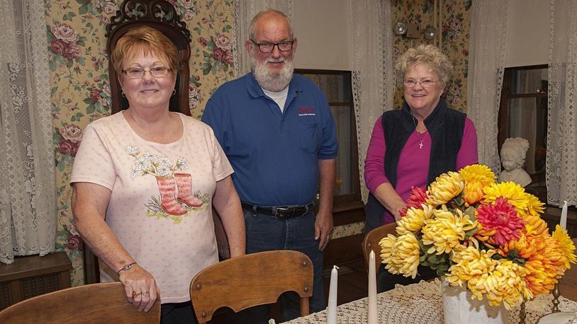 Dolly McKeehan (left), Milton Cook and Linda Morgan are among the volunteer staff at the Waynesville Museum at the Friends Home. They are pictured in the museum’s dining room. CONTRIBUTED