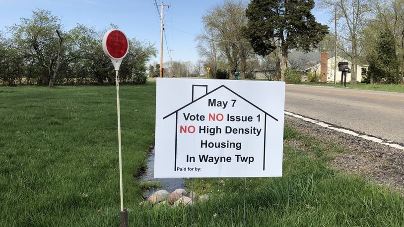 Supporters of a referendum on a residential subdivision planned in Wayne Twp., Warren County, said they had 25 signs promoting passage. STAFF/LAWRENCE BUDD