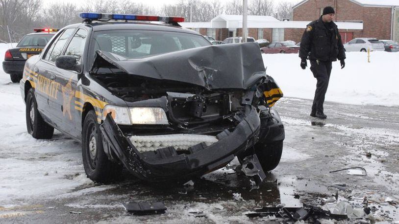 A Montgomery County Sheriff’s deputy was injured after his cruiser was hit by a Jefferson Township snow plow in February 2014. STAFF