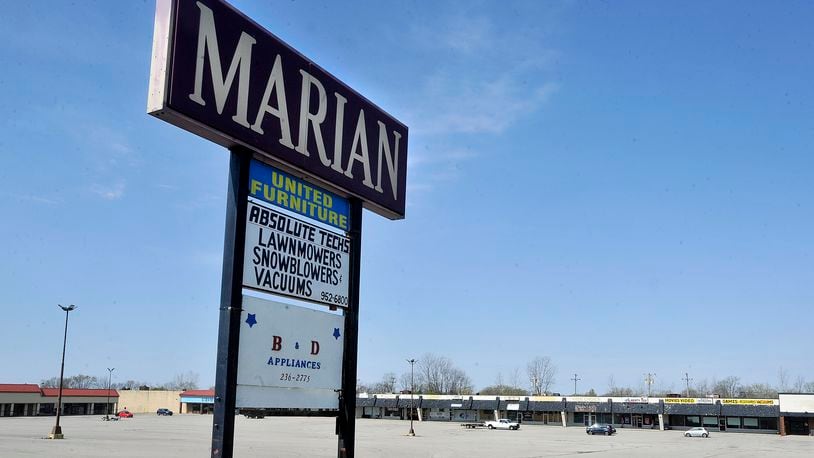 The city of Huber Heights purchased the Marian Shopping Center on Brandt Pike for $2.8 million earlier this year. The city now could purchase additional land behind the shopping center. MARSHALL GORBYSTAFF