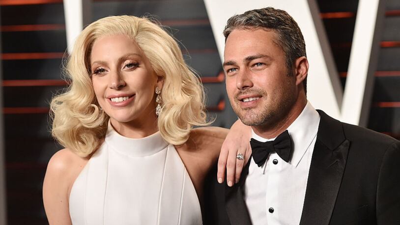 BEVERLY HILLS, CA - FEBRUARY 28:  Recording artist Lady Gaga, left, and Taylor Kinney arrive at the 2016 Vanity Fair Oscar Party Hosted By Graydon Carter at Wallis Annenberg Center for the Performing Arts on February 28, 2016 in Beverly Hills, California.  (Photo by John Shearer/Getty Images)