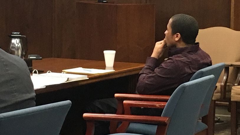 Quentin Brown, 17, of Dayton sits in a Montgomery County Common Pleas courtroom Monday as opening statements are delivered in his murder trial. He is accused in the death of Benjamin Werner of Lebanon.