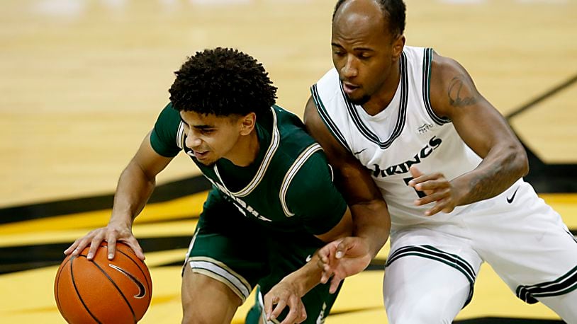 Wright State guard Trey Calvin is covered by Cleveland State guard Demetrius Terry during a Horizon League game at the Nutter Center in Fairborn Jan. 16, 2021. Wright State won 85-49. Contributed photo by E.L. Hubbard
