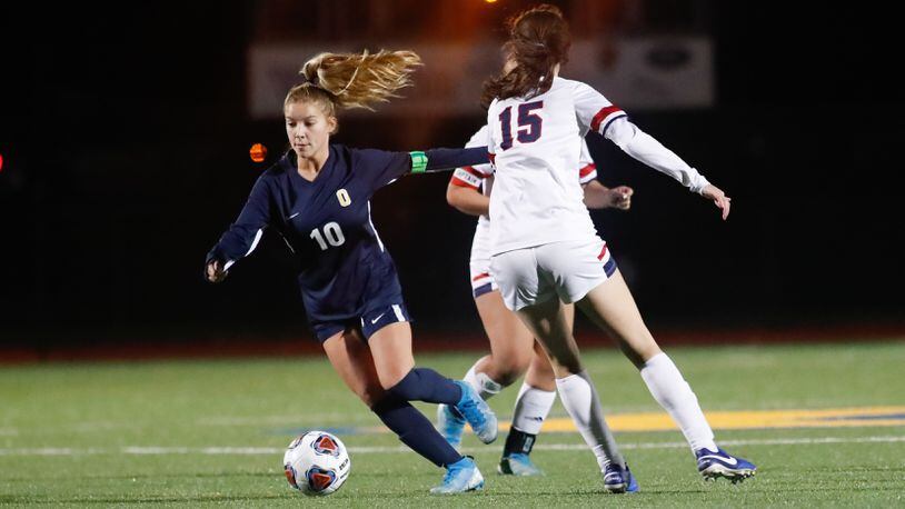 Cutline: Oakwood High School senior Riley Beam dribbles the ball during their game against Columbus Bishop Hartley on Tuesday night at Lane Stadium. Oakwood won 2-0. CONTRIBUTED PHOTO BY MICHAEL COOPER