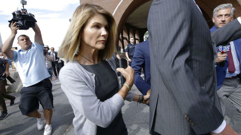 FILE PHOTO: Lori Loughlin, her fashion designer husband, Mossimo Giannulli, and nine other parents face new charges in the college admissions scandal.