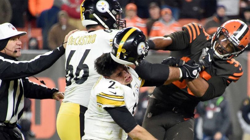 Defensive end Myles Garrett #95 of the Cleveland Browns hits Quarterback Mason Rudolph #2 of the Pittsburgh Steelers over the head with his helmet during the second half in the game at FirstEnergy Stadium on November 14, 2019 in Cleveland, Ohio.