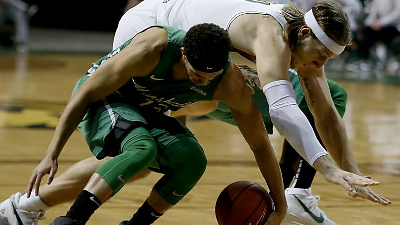 Wright State center Loudon Love battles Marshall guard Jarrod West for the ball during a game at the Nutter Center in Fairborn Thursday, Dec. 3, 2020. (E.L. Hubbard for the Dayton Daily News)