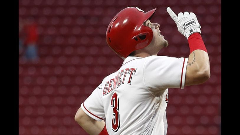 Scooter Gennett hit a pair of home runs Tuesday night to lift the Reds past the Braves. GETTY IMAGES