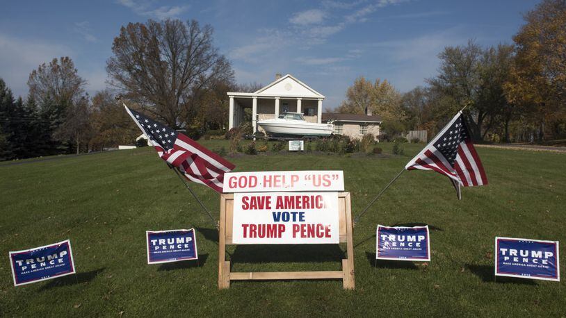 Campaign signs, supporting Donald Trump and Mike Pence, are displayed on November 8, 2016 in Salem, Ohio. This year, roughly 200 million Americans have registered to vote in this years general election. (Photo by Ty Wright/Getty Images)
