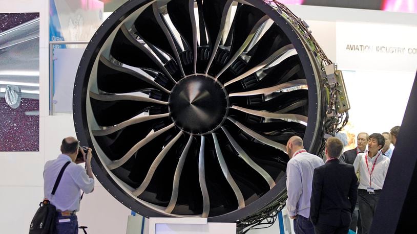 In this 2013 file photo, visitors watch General Electric’s GEnx engine at the Paris Air Show at Le Bourget airport, north of Paris. AP
