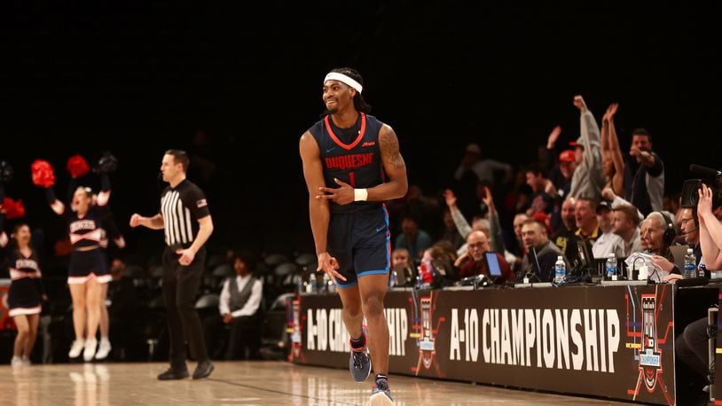 Duquesne's Jimmy Clark III celebrates after making a 3-pointer against Dayton in the final minutes in the Atlantic 10 Conference tournament quarterfinals on Thursday, March 14, 2024, at the Barclays Center in Brooklyn, N.Y. David Jablonski/Staff