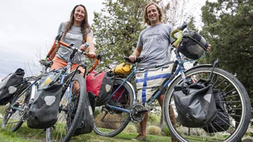 Kristen and Ville Jokinen stand by their bikes near their Bend home on last week. The couple recently completed a 20-month cycling journey together that logged more than18,000 miles from Alaska to Argentina. (Ryan Brennecke/Bulletin Bend/TNS)