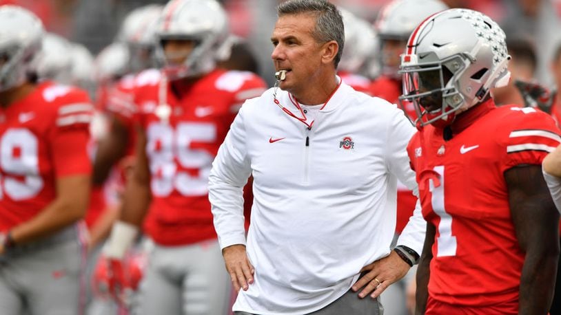 COLUMBUS, OH - SEPTEMBER 22: Head Coach Urban Meyer of the Ohio State Buckeyes watches as his team warms up before a game against the Tulane Green Wave at Ohio Stadium on September 22, 2018 in Columbus, Ohio. (Photo by Jamie Sabau/Getty Images)