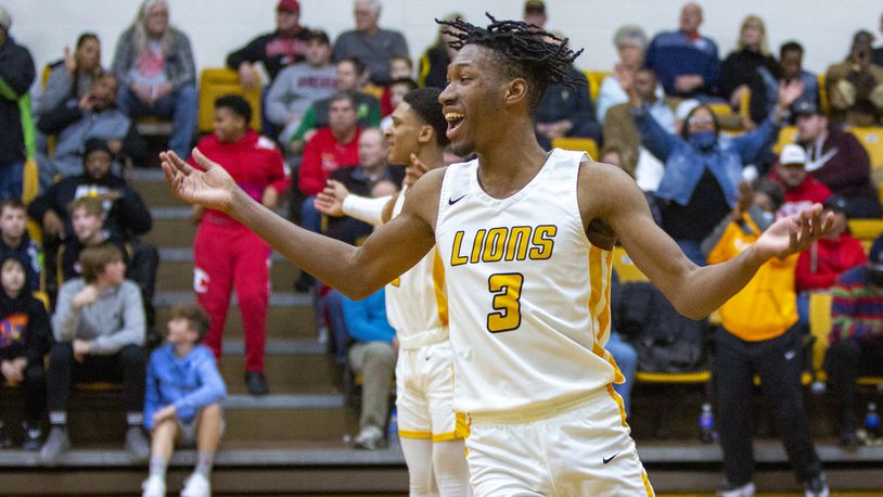 Meadowdale's Lee Benson III begins celebrating as the final seconds tick off in the Lions' 50-45 district semifinal victory over Preble Shawnee on Saturday at Vandalia Butler. Jeff Gilbert/CONTRIBUTED