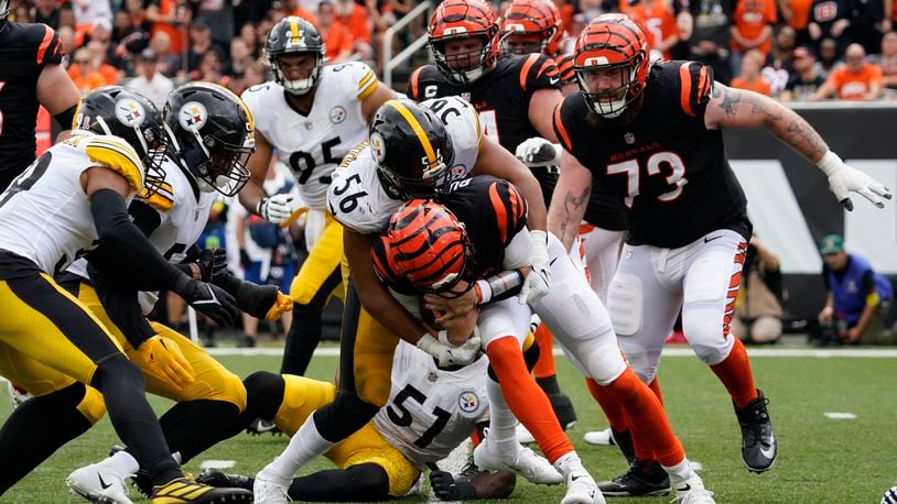 Pittsburgh Steelers linebacker Alex Highsmith (56) sacks Cincinnati Bengals quarterback Joe Burrow, center bottom, during the second half of an NFL football game, Sunday, Sept. 11, 2022, in Cincinnati. (AP Photo/Joshua A. Bickel)