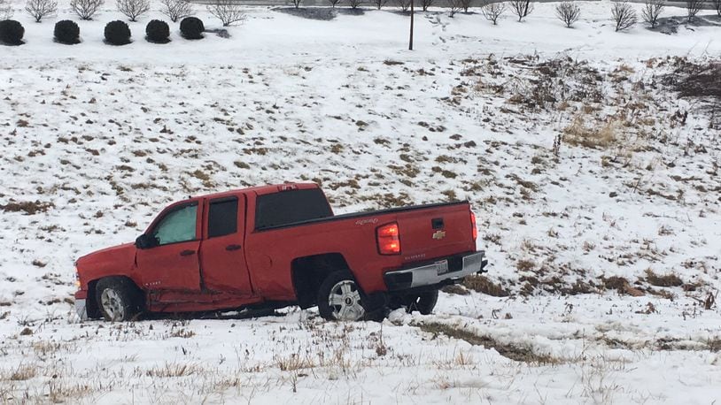 Icy conditions caused this accident, one of many in the Dayton area on Monday, Jan. 8. CHUCK HAMLIN/STAFF