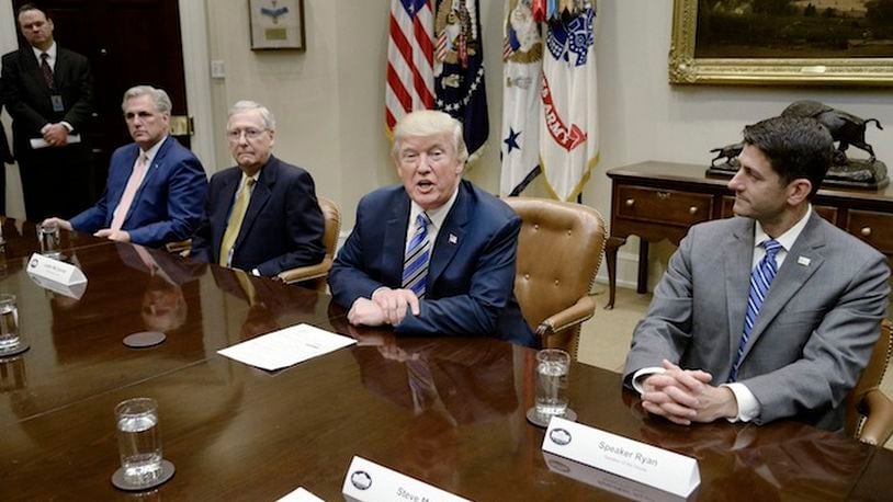 President Donald Trump speaks as Senate Majority Leader Mitch McConnell, second from left, and House Speaker Paul Ryan listen during a meeting with House and Senate leadership on June 6, 2017 in the Roosevelt Room of the White House in Washington, D.C. (Olivier Douliery/Abaca Press/TNS)