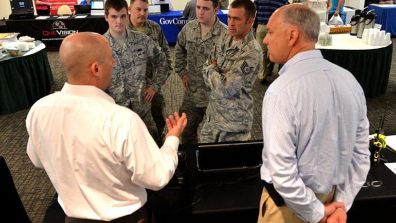 Airmen attending a 2017 Tech Expo participate in a discussion with a technology vendor. Tech Expos connect government and industry to collaborate on mission requirements and technology solutions. (Courtesy photo)