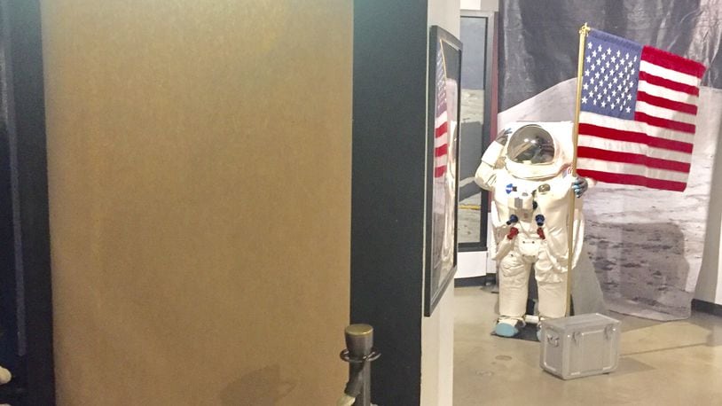 The exhibit that showcased the golden lunar space module, which was taken from the Armstrong Air and Space Museum late Friday night, has been covered up as multiple entities are investigating the theft of the rare artifact. STAFF/STEVE BAKER