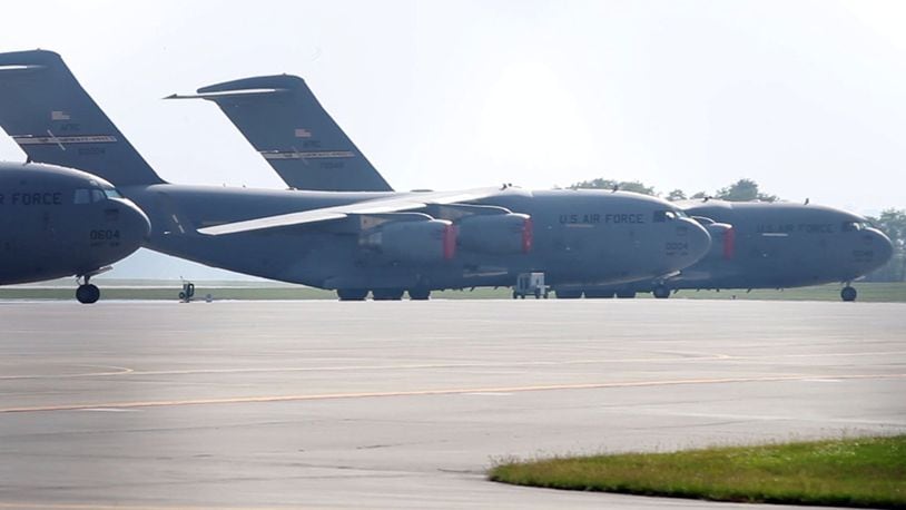 Six Air Force C-17 transport jets with the 445th Airlift Wing sit idle at Wright-Patterson Air Force Base during a partial federal government shutdown in 2013. TY GREENLEES / STAFF FILE PHOTO