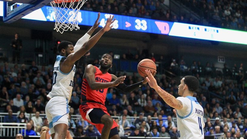 Dayton's Jalen Crutcher scores against Rhode Island in the first half on Wednesday, March 4, 2020, at the Ryan Center in Kingston, R.I.