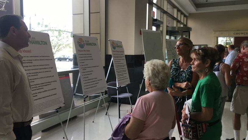 Residents review suggestions made during Plan Hamilton meetings as part of a visioning process for what the city can become during the next 10 to 15 years. MIKE RUTLEDGE/STAFF