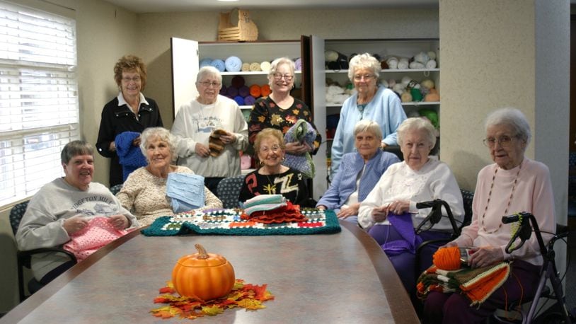 The Knitting Ladies of OLP. Seated (from left): Mary Coutts, Marie Nixon, Betty Alter, Dottie Itsler, Jane Woolley and Helen Mace. Standing (from left): Pam Graeser, Anna Parr, Barbara Beel and Peg Neff. Not pictured: Judy Kelly. PAMELA DILLON/CONTRIBUTED