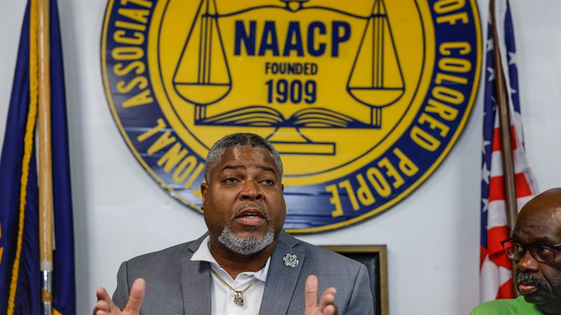 Derrick Foward, President of the Dayton Unit of the N.A.A.C.P.  talks to he media Wednesday June 29 about the city of  Huber Heights search for a new city manager.  JIM NOELKER/STAFF