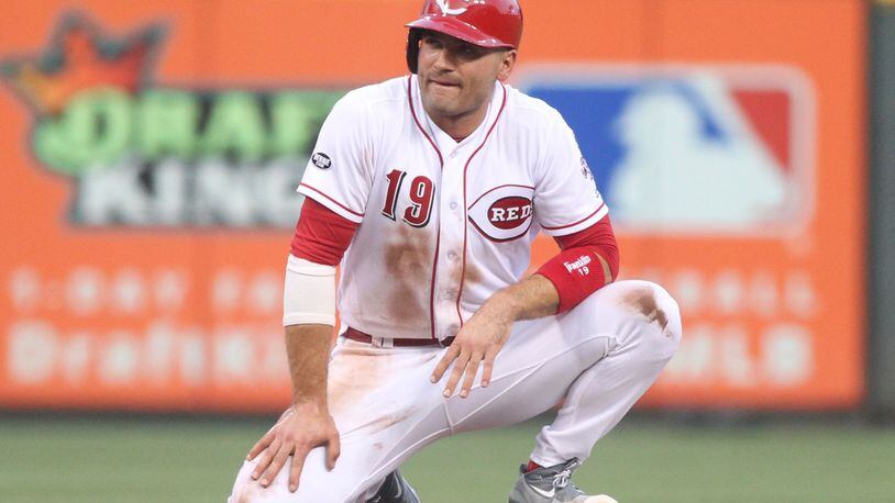 The Reds' Joey Votto pauses after sliding back into second base against the Cardinals on Tuesday, Aug. 2, 2016, at Great American Ball Park in Cincinnati. David Jablonski/Staff