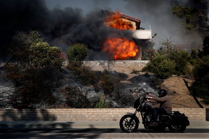 Winds whip up California fires, prompting evacuations