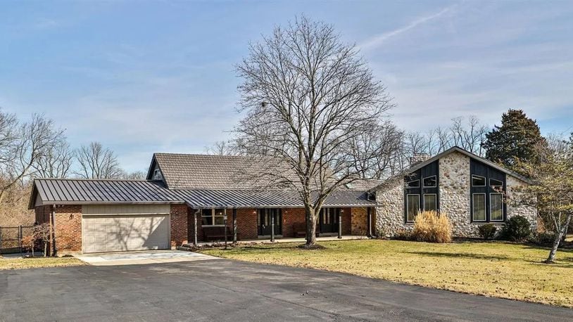 Nearly unlimited living options are under one roof in this multi-level brick and stone home on 9.5 acres in Monroe Twp. CONTRIBUTED PHOTOS