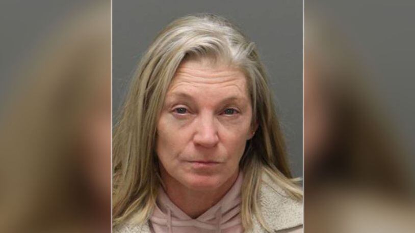 57-year-old Lisa Marie Burns was arrested Friday and charged with ethnic intimidation and property damage. (WSOCTV.com)