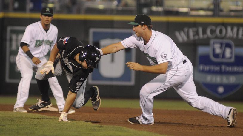 Dragons first baseman Bruce Yari tags out Nick Sinay of the Lugnuts after he was picked off first base. The Dragons (Reds) lost 4-3 to the Lansing Lugnuts (Blue Jays) in a Class A minor-league baseball game at Dayton’s Fifth Third Field on Tuesday, Aug. 8, 2017. MARC PENDLETON / STAFF