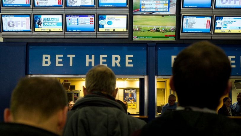 ESHER, ENGLAND - FEBRUARY 04: Racegoers in the betting shop area at Sandown Park on February 4, 2017 in Esher, England. (Photo by Alan Crowhurst/Getty Images)