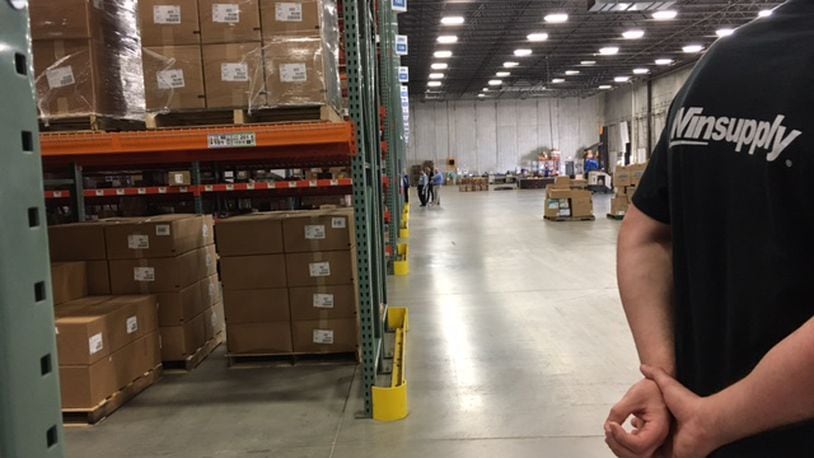 Members of the Dayton Area Logistics Association toured the Winsupply regional distribution center in Miamisburg last year. THOMAS GNAU/STAFF
