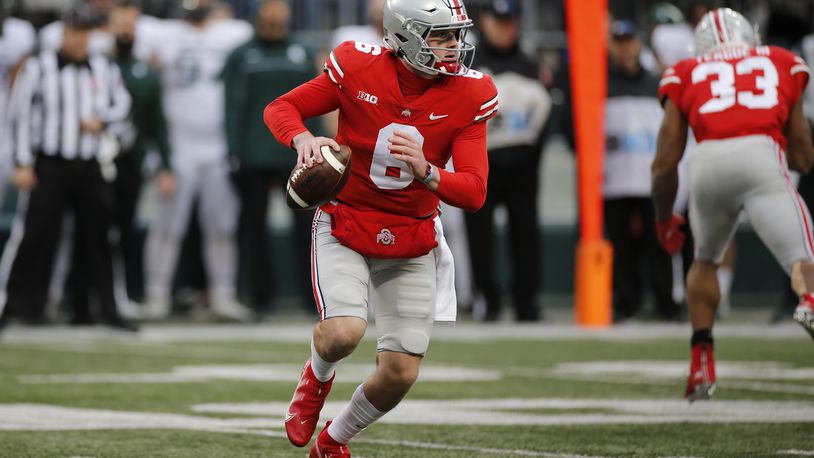 Ohio State quarterback Kyle McCord looks for an open receiver against Michigan State during the second half of an NCAA college football game Saturday, Nov. 20, 2021, in Columbus, Ohio. (AP Photo/Jay LaPrete)