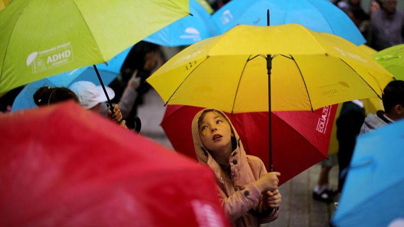 Children dance with their umbrellas at the launch of an art installation called the Umbrella Project on June 22, 2017 in Liverpool, England. The project was aimed at raising awareness of ADHD and autism in children.